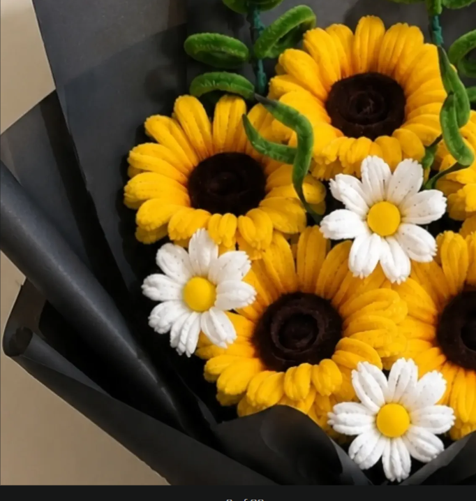 Crochet sunflower bouquet with daisies, black wrap, side view